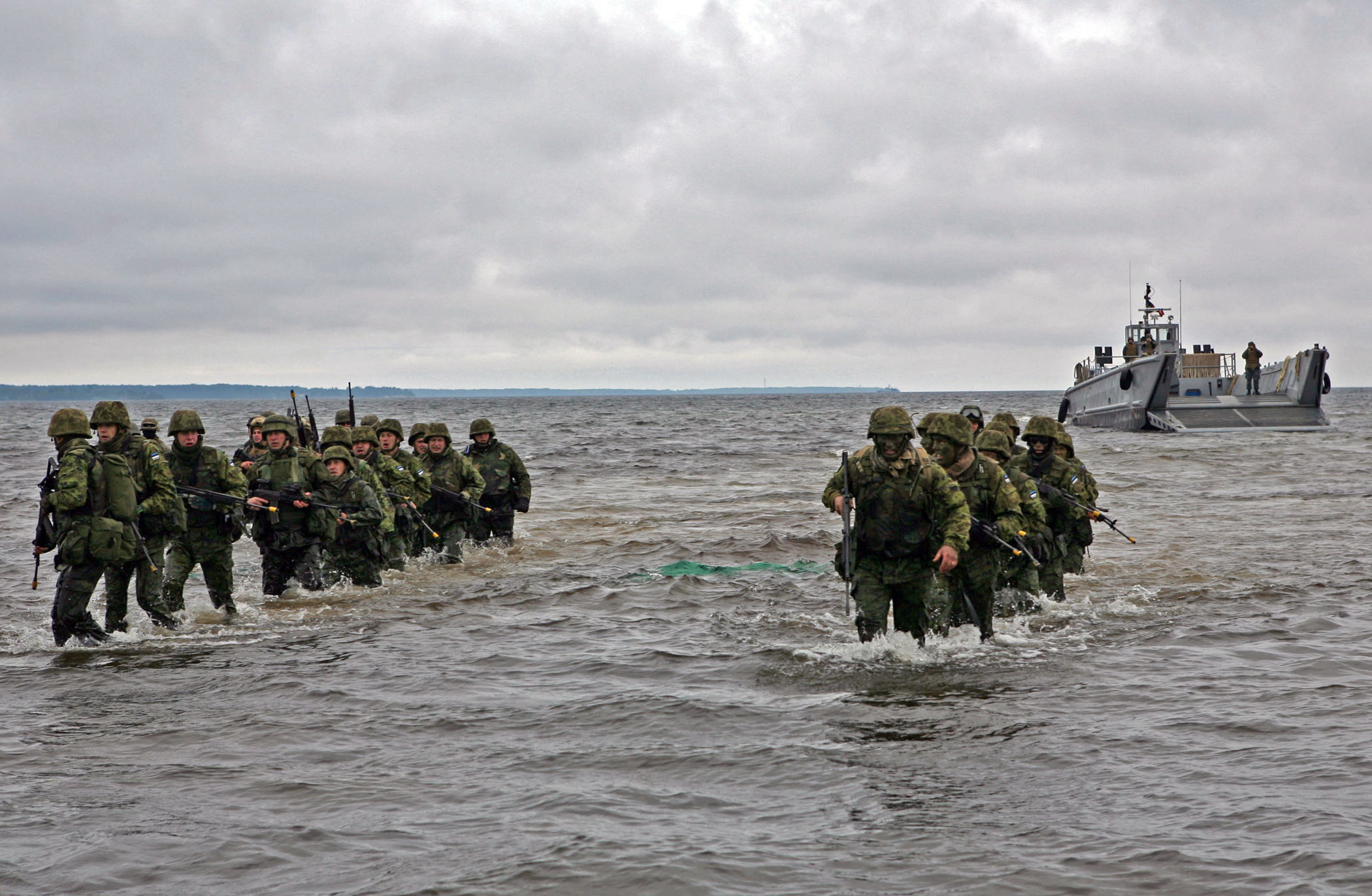 100615-M-0884D-033 LOSKA, Estonia (June 15, 2010) Estonian soldiers wade ashore during a combined U.S. and Estonia amphibious assault training exercise during Baltic Operations (BALTOPS) 2010. BALTOPS is an annual exercise to improve interoperability and cooperation among regional allies by conducting realistic training with the 12 participating nations. (U.S. Marine Corps photo by Sgt. Rocco DeFilippis/Released)