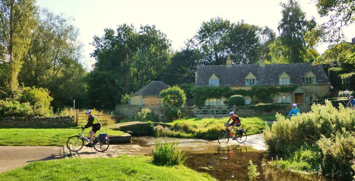Bainton Bikes - crossing the ford at The Slaughters